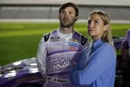 <a href='https://www.sportskeeda.com/go/nascar-cup-series' target='_blank' rel='noopener noreferrer'>NASCAR</a> Cup Series 65th Annual Daytona 500 - Busch Light Pole Qualifying DAYTONA BEACH, FLORIDA - FEBRUARY 15: Julia Piquet and Daniel Suarez, driver of the #99 Tootsies Orchid Lounge Chevrolet, look on during qualifying for the Busch Light Pole at Daytona International Speedway on February 15, 2023 in Daytona Beach, Florida. (Photo by Sean Gardner/Getty Images)